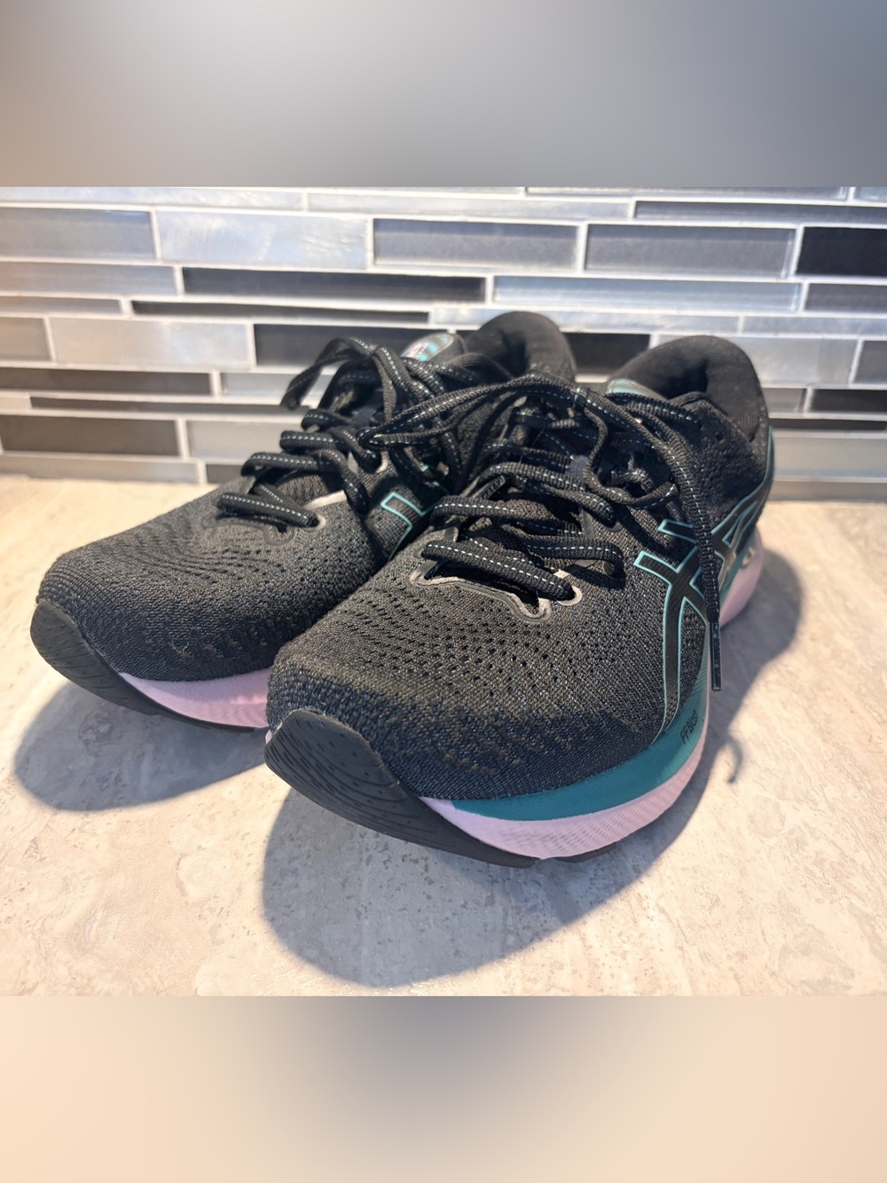 Women’s Black ASICS Gel-Cumulus 25 Running Sneakers with Teal and Pink Accents
